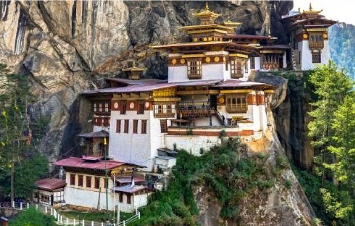 An image traditional Buthan constructions on a hill.